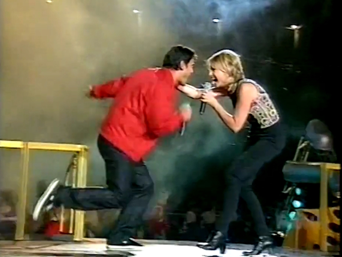 Olivia Newton-John performs at Super League Cup Grand Final September 1997